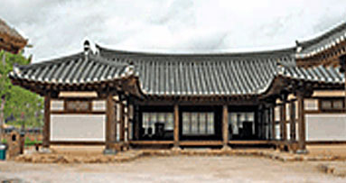 Traditional thatched-roof houses, two tile-roof houses, and the reproduced Magistrate’s Office and Living Quarters